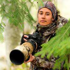 une personne avec son appareil de photographie